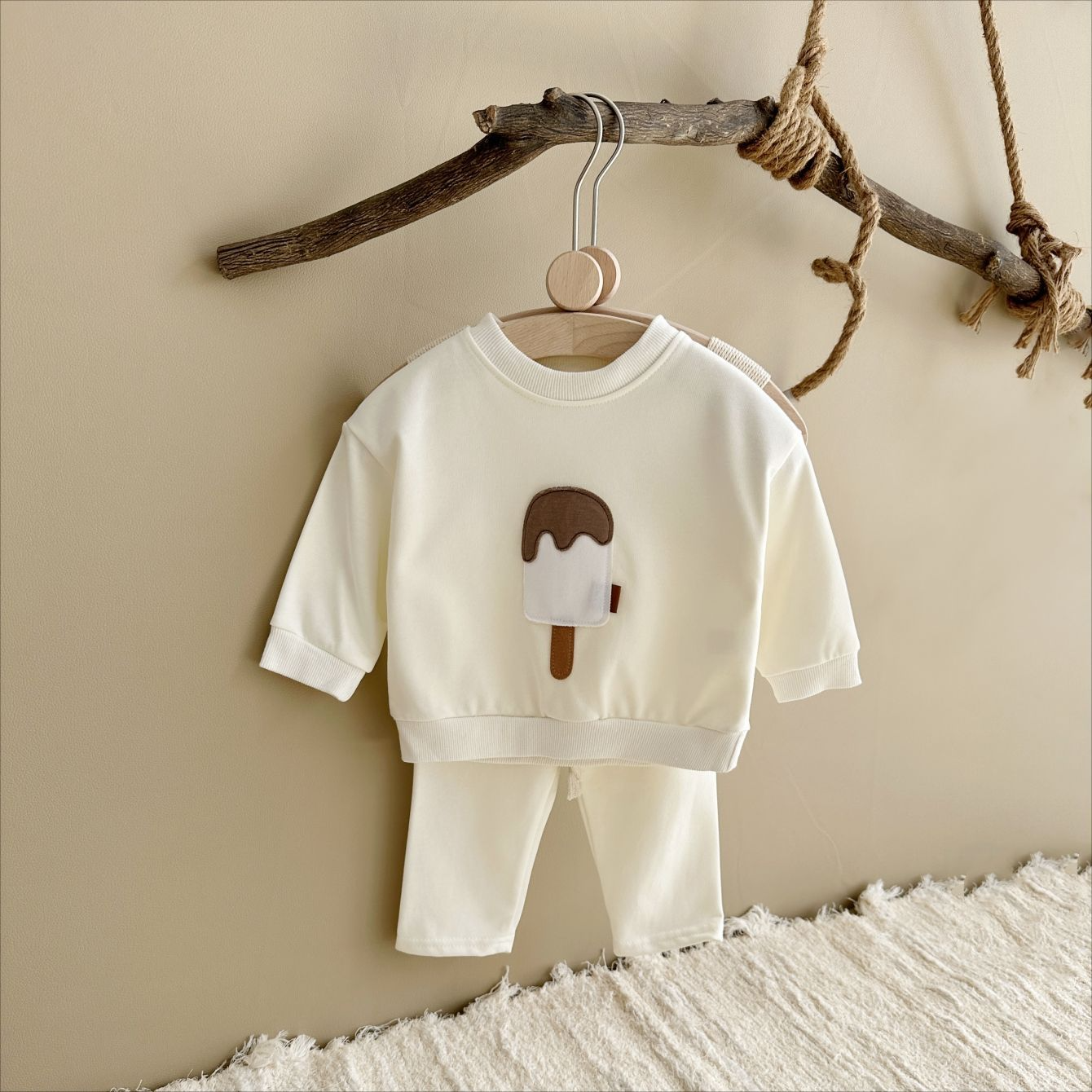 Baby outfit set with a shirt featuring a cute ice cream design and comfy pants, available in various colors for playful and comfortable everyday wear.