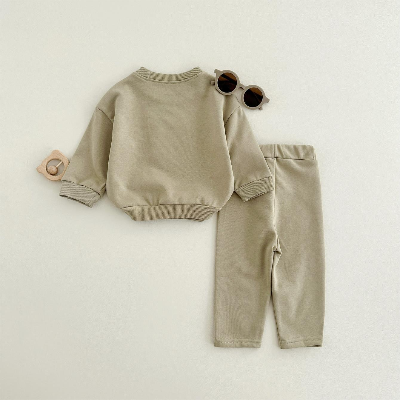 Baby outfit set with a shirt featuring a cute ice cream design and comfy pants, available in various colors for playful and comfortable everyday wear.