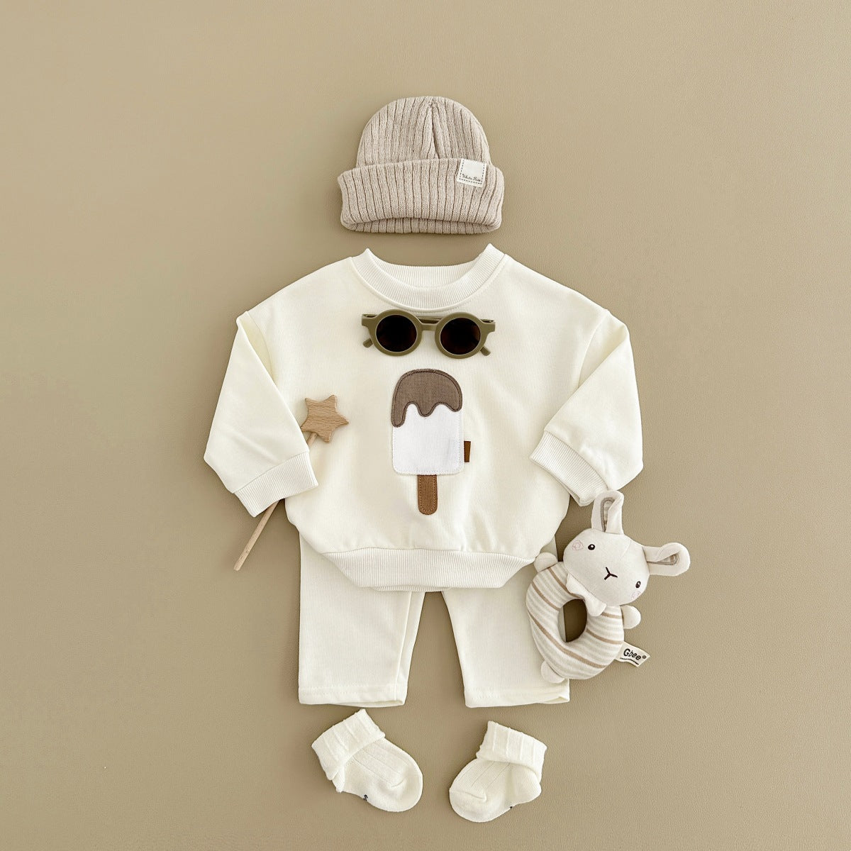 Baby outfit set with a shirt featuring a cute ice cream design and comfy pants, available in various colors for playful and comfortable everyday wear.