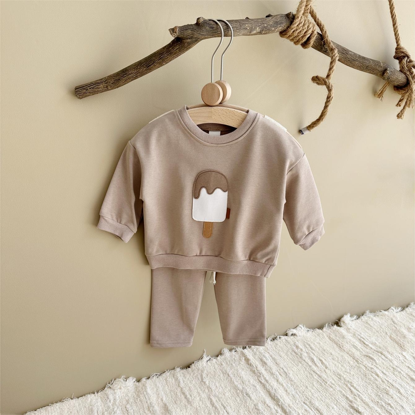 Baby outfit set with a shirt featuring a cute ice cream design and comfy pants, available in various colors for playful and comfortable everyday wear.