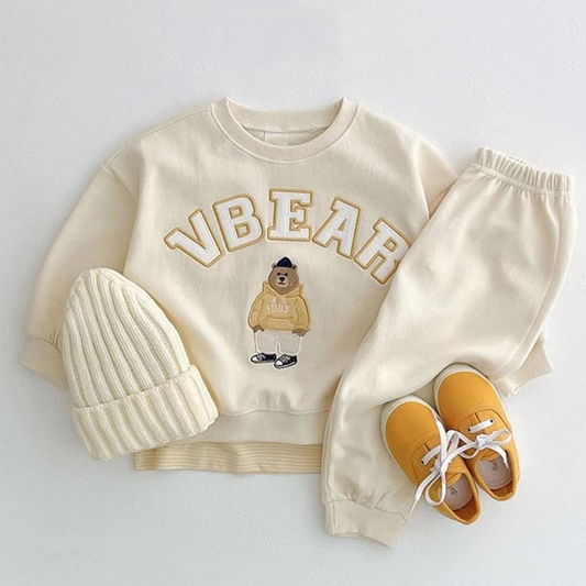 Elegant Comfy Baby Outfit featuring a top and matching pants with elasticized ankles, perfect for both casual and dressy occasions. Combines style and comfort for everyday wear.