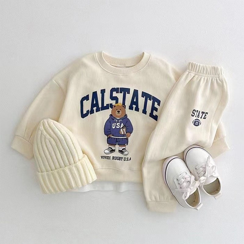 Comfy Baby Outfit featuring an elegant tracksuit with a top and matching pants. Designed with elasticized ankles for added comfort and style, perfect for both casual and dressy occasions.