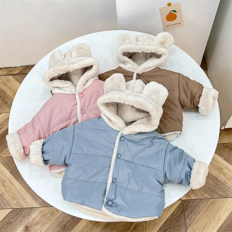 Adorable baby winter jackets with cozy fleece lining and cute bear ears. Available in pastel pink, sky blue, and warm beige—perfect for keeping your little one warm and stylish on chilly days!