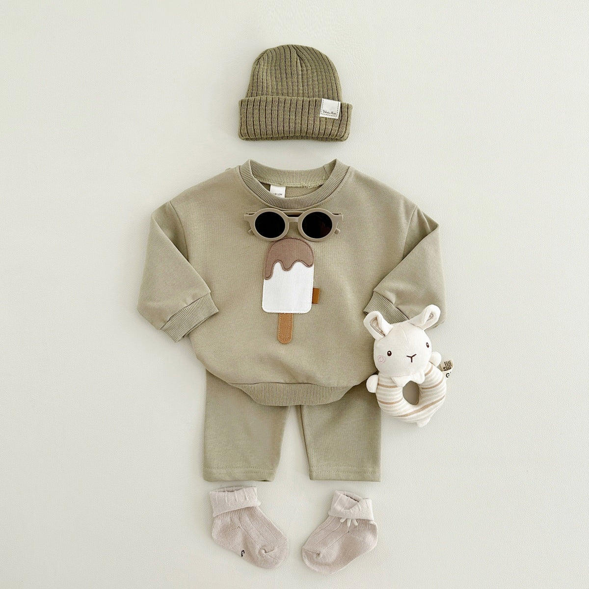 Baby outfit set with a shirt featuring a cute ice cream design and comfy pants, available in various colors for playful and comfortable everyday wear.