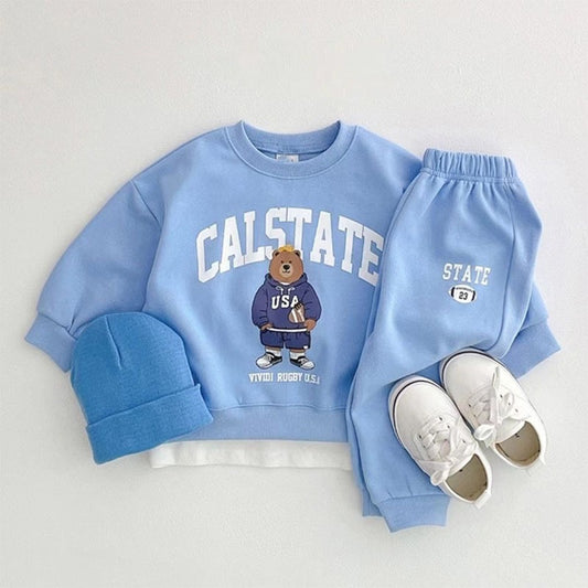 Comfy Baby Outfit featuring an elegant tracksuit with a top and matching pants. Designed with elasticized ankles for added comfort and style, perfect for both casual and dressy occasions.